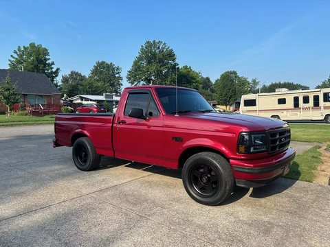 Red classic pickup truck with tinted windows