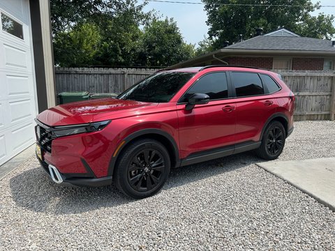 Red compact SUV with tinted windows