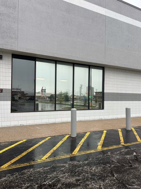 Commercial storefront with dark tinted windows