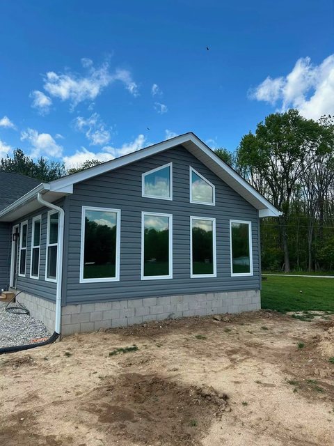 New-build home with a wall of tinted windows